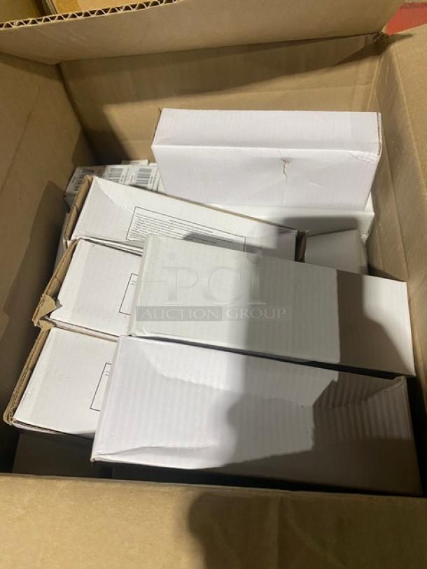 Box of assorted white cardboard boxes, stacked inside a larger box. Some boxes show light wear and creases.