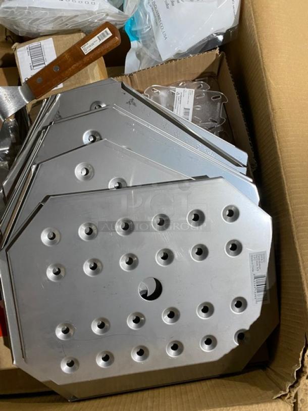 Box of stainless steel perforated plates with round holes and a central cutout; includes a wooden-handled tool. New condition.