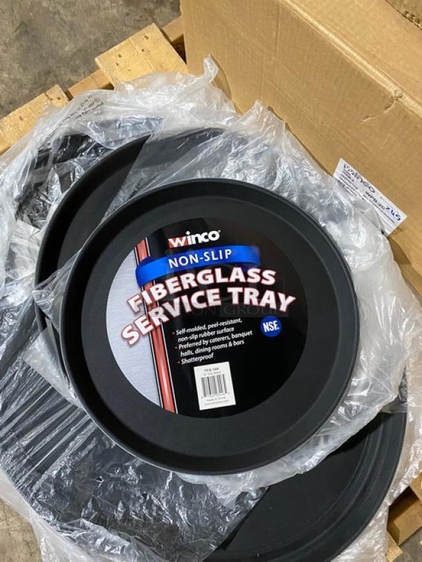 Winco non-slip fiberglass service tray, round, black, new condition. Features self-molded surface, NSF certified.