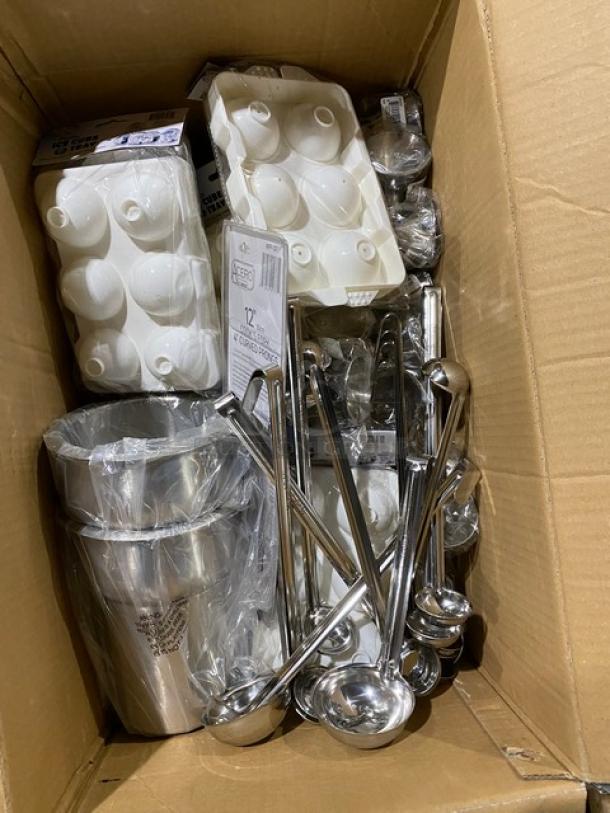 Box of stainless steel ladles and kitchen tools, including ice molds and a bucket, new with packaging, ideal for catering.