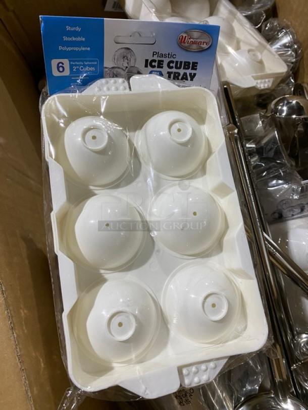 Plastic ice cube tray with six round molds, sturdy and stackable design by Winware. New condition in original packaging.