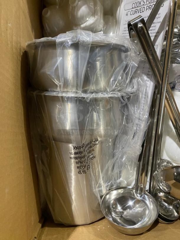 Stainless steel mixing bowls in plastic wrap with ladles, new condition. Warning label for safe use visible.