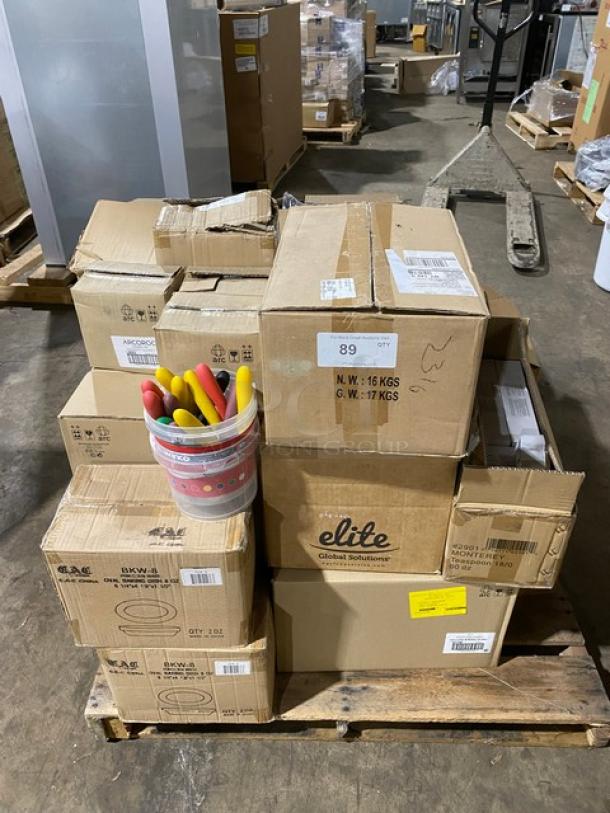 Pallet of assorted cardboard boxes labeled "Elite Global Solutions," various sizes and weights, includes a bucket of colorful handles.