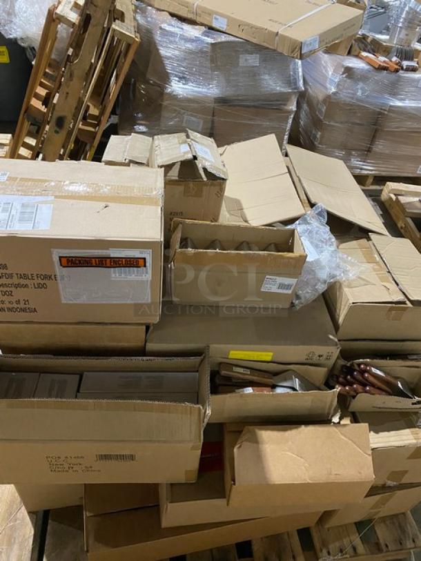 Boxes of assorted items on pallets. Some boxes are open, revealing tableware. Labels show packing and handling details.