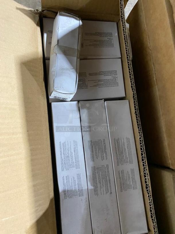 Box of sealed electronics, multiple units in original packaging, text instructions on boxes, items new and unopened.