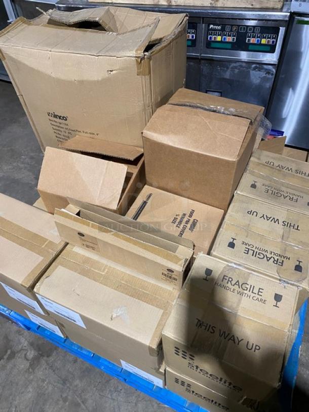 Pallet of assorted cardboard boxes, various sizes, marked "Fragile" and "This Way Up," in fair condition.