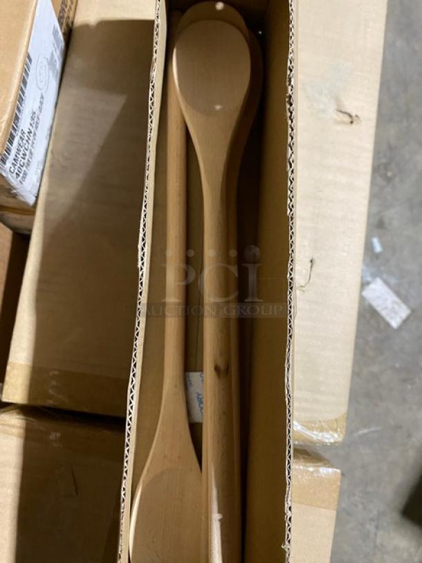 Wooden spoon set in box, includes two spoons, new condition. Ideal for cooking, natural finish, no visible markings.