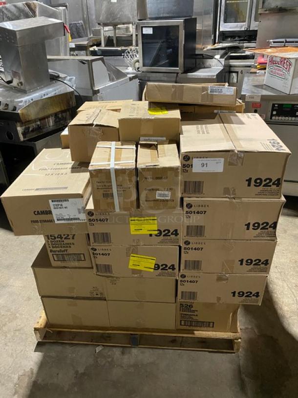 Pallet stacked with assorted boxed kitchen equipment, labels indicate Cambro food storage, showing model numbers and barcodes.