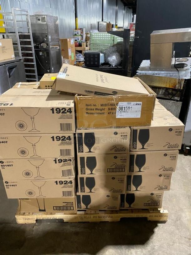 Stack of Libbey drinking glass boxes on a pallet, item numbers 1924 and 9168, in original packaging, warehouse setting.