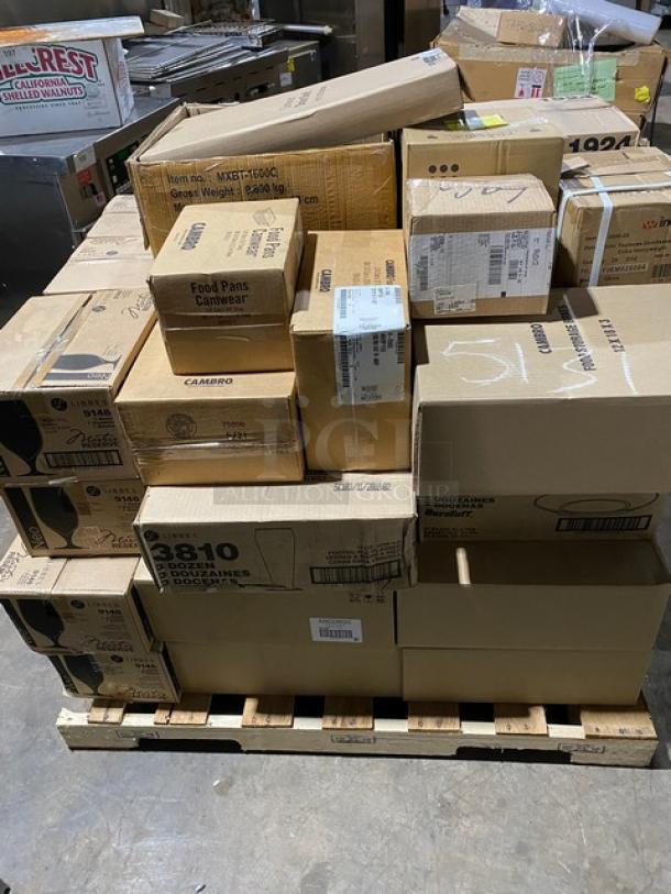Pallet of assorted cardboard boxes, various sizes, stacked neatly. Labels indicate contents like Cambro food pans.
