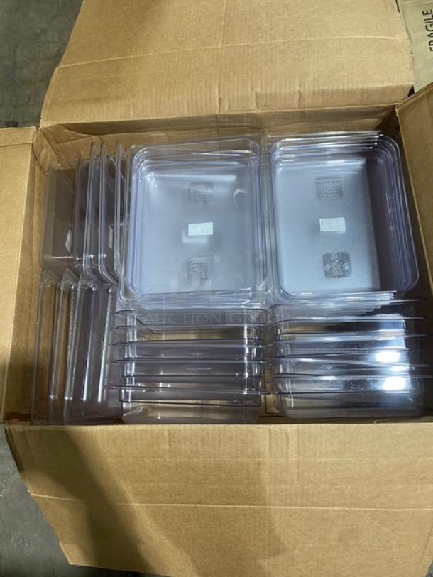 Box of clear plastic food trays with visible QR codes and recycling symbols, in new condition.