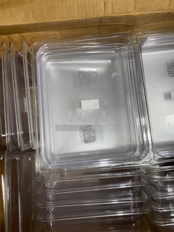 Stack of clear plastic food containers in a cardboard box, pristine condition, with a textured finish on lids.