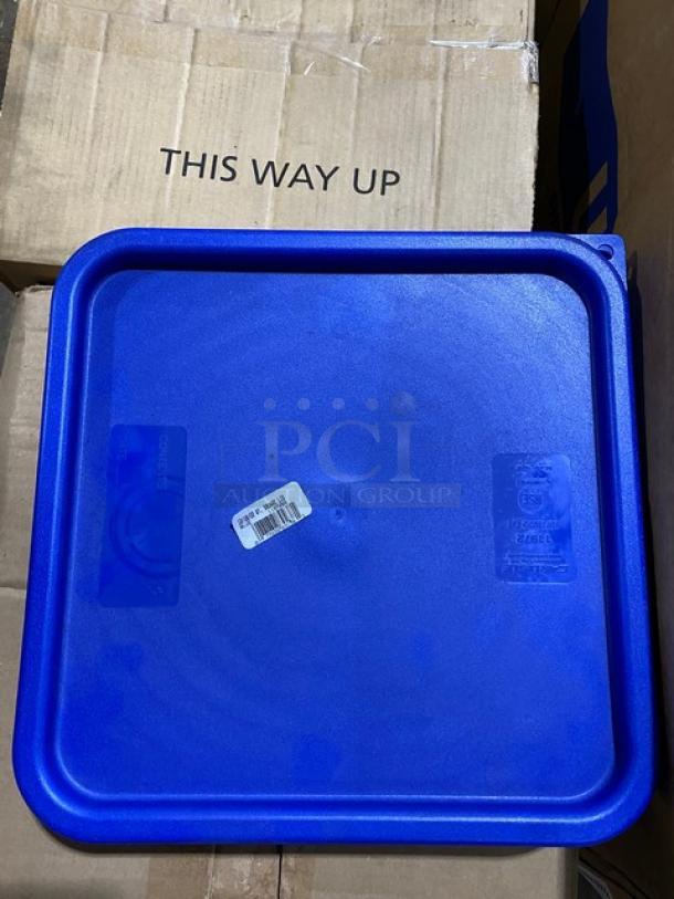 Blue square plastic lid with barcode sticker, embossed markings indicating brand and model number, set on cardboard box.