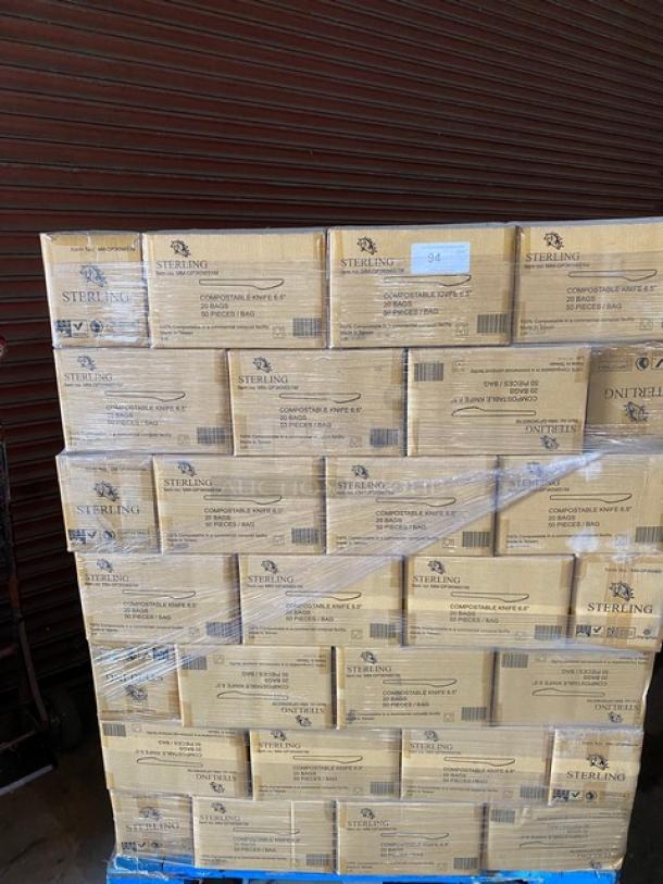 Pallet of Sterling compostable knives, sealed boxes, labeled 6.5 inches, 10 pieces per bag, stacked and wrapped in plastic.