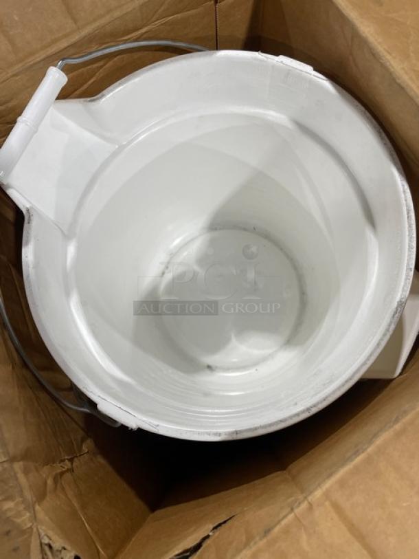 Cardboard box containing a white plastic bucket with a metal handle, viewed from above. New condition.