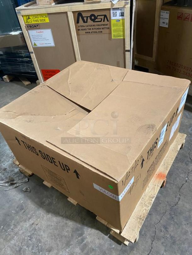 Brand new Vulcan VACB36101 stainless steel gas-powered char broiler, unopened in box with labeling, on wooden pallet.