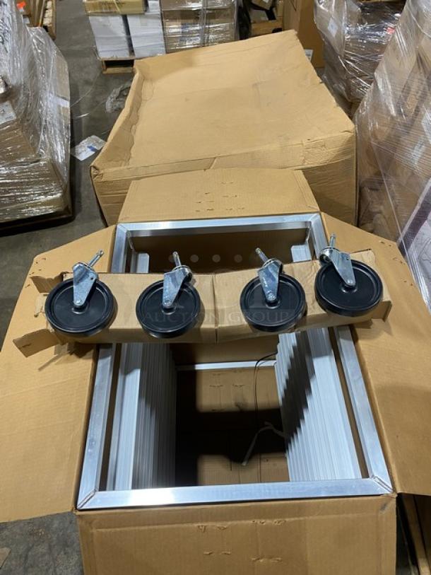Brand new New Age Industries aluminum half-size sheet pan rack, model 1312, with open top and casters, in box.
