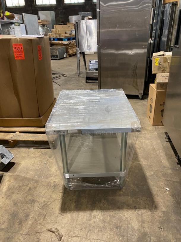 Brand new Adcraft ES3024 stainless steel equipment stand with undershelf; includes back and side splash; on legs; wrapped.