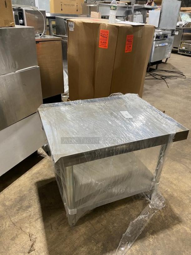 Adcraft ES3024 stainless steel equipment stand, brand new, with undershelf, back and side splashes, and legs.
