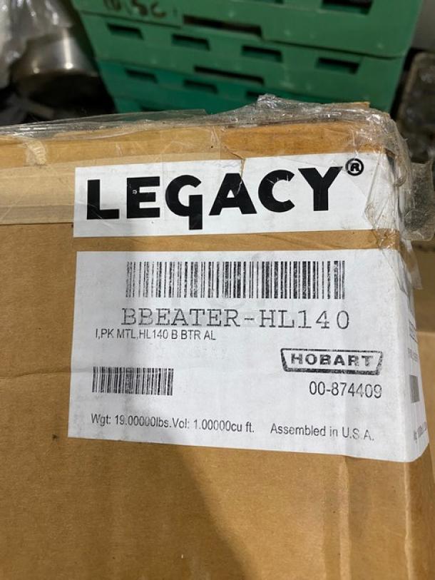Brand new Hobart Legacy Series aluminum flat beater, Model BEATERHL140, in packaging with label indicating assembly in the USA.