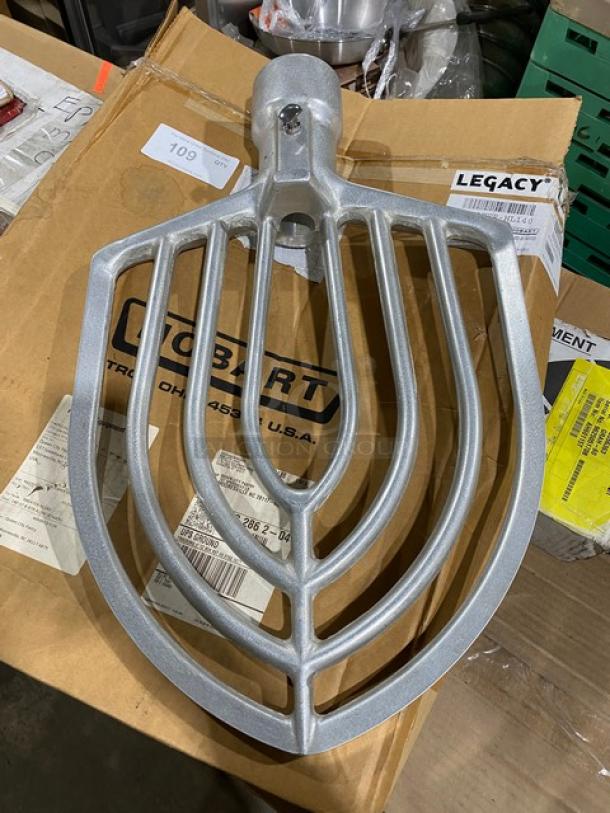 Brand new Hobart Legacy Series aluminum flat beater, model BEATER-HL140, on original packaging, shows markings and barcode.