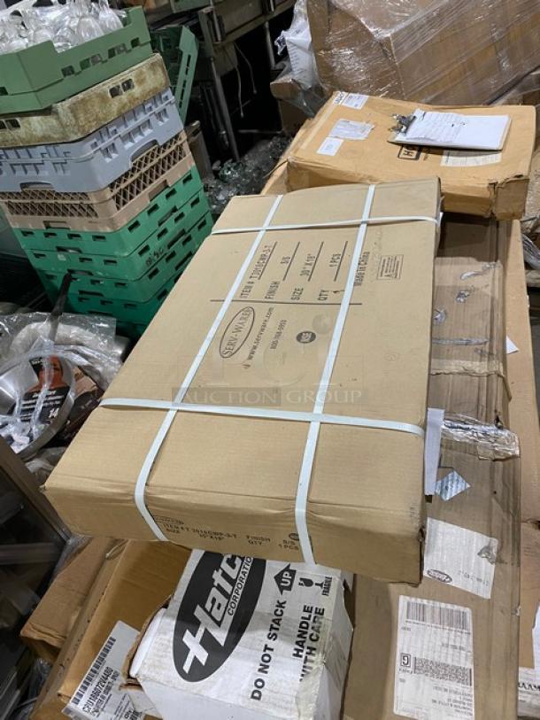 Serv-Ware commercial stainless steel filler table, model T3018CWP3T, packaged in box. Features include 18"x30" size, 2" upturned backsplash.