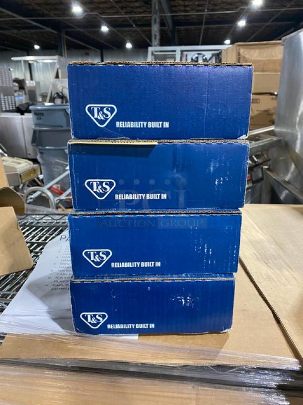 Stack of four T&S model B-0529 boxes in warehouse, labeled "Reliability Built In." Brand new wall-mount swivel gooseneck faucet.