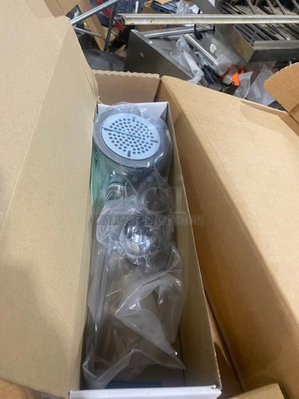 Brand new T&S B-3950-01 twist lever waste drain with snap-in strainer and overflow tube in packaging.