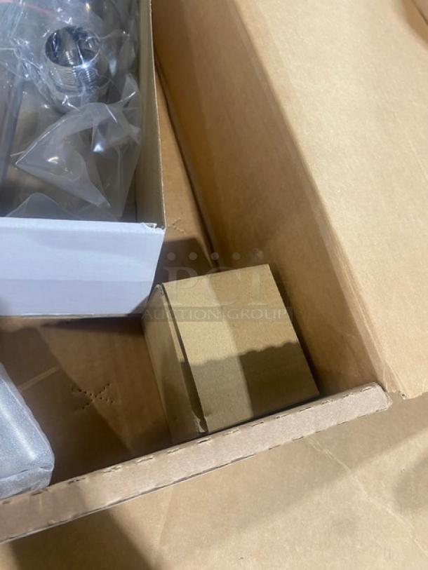 Brand new T&S B395001 twist lever waste drain in box, chrome-plated, with snap-in strainer and overflow tube.