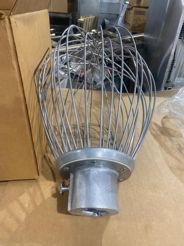 Brand new Hobart Legacy Series stainless steel 80 qt. wire whip attachment, model DWHIP-HL80, on cardboard surface.