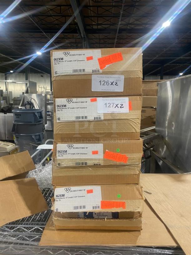 Stack of boxes containing T&S Model 062XM chrome plated 12" swing nozzles, brand new, with visible labels and condition markings.