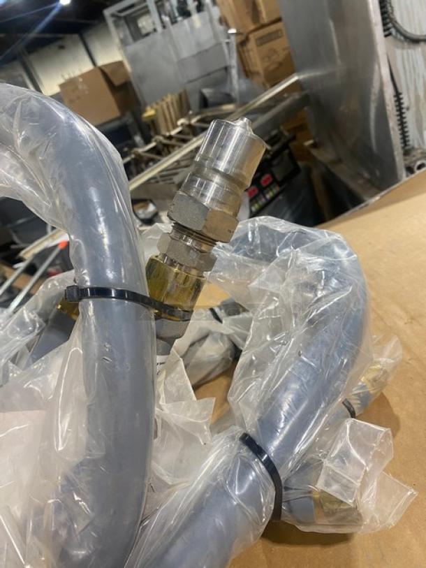 Brand new Dormont 3/4" x 60" coated water connector hose, Model W75BP60, in packaging. Chrome fittings visible.