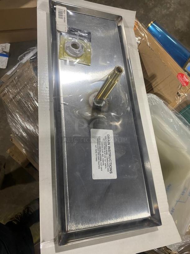 Brand new Perlick C18645A stainless steel top-mount drip tray with faucet coupling nut. Features label with drain instructions.