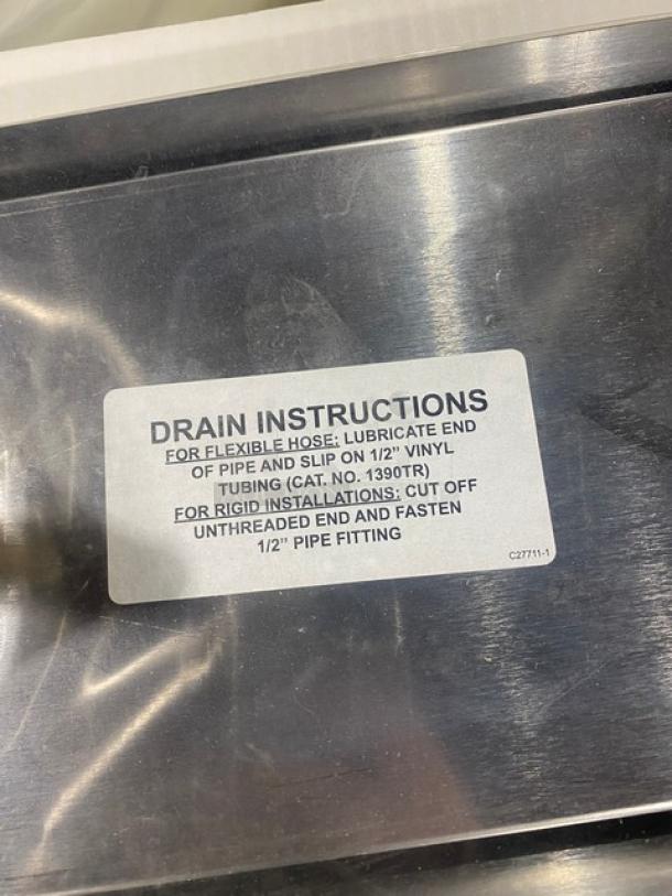 Perlick stainless steel top-mount drip tray, model C18645A, brand new, with faucet coupling nut and drain instructions label.