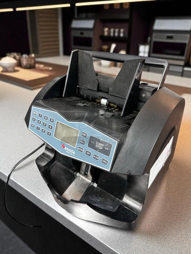 Cassida Advantec 75 bill counter, excellent condition, 120V. Features control panel with multiple functions. Fully tested.