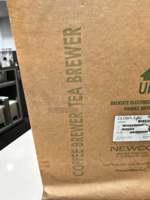 Brand new Newco CLDBR-3.5G cold brew brewer, 3.5-gallon, in original packaging. Model 123320 label visible.