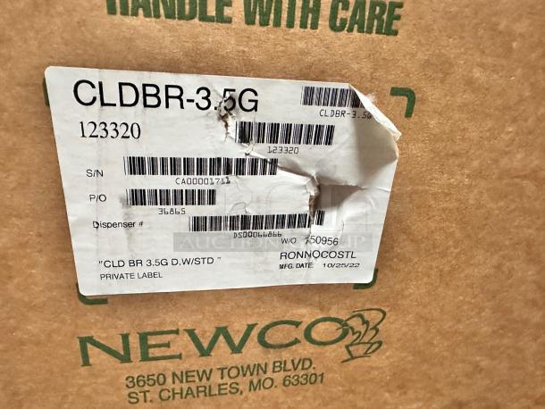 Brand new Newco 123320 cold brew brewer, model CLDBR-3.5G, fully packaged with dispenser/stand. Box label shows model and serial numbers.