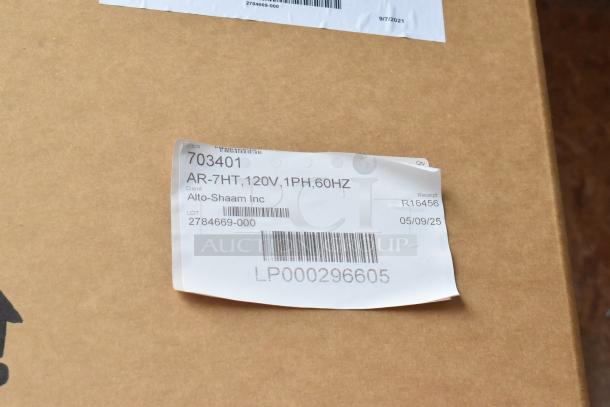 Brand new Alto Shaam AR-7HT Stainless Steel Heated Cabinet in box. Label shows model, voltage, and lot number.