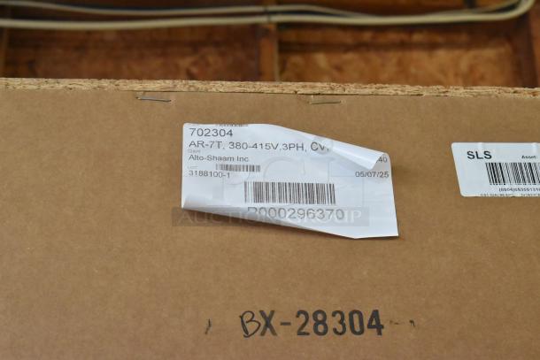 Brand new Alto Shaam AR-7T commercial rotisserie oven in box. Label shows AR-7T, 380-415V, 3PH, client Alto-Shaam Inc.