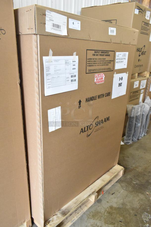 Brand new Alto Shaam AR-7EVH rotisserie oven in box. Stainless steel, 7 spit capacity, 240V, 1 phase. Handle with care labels.