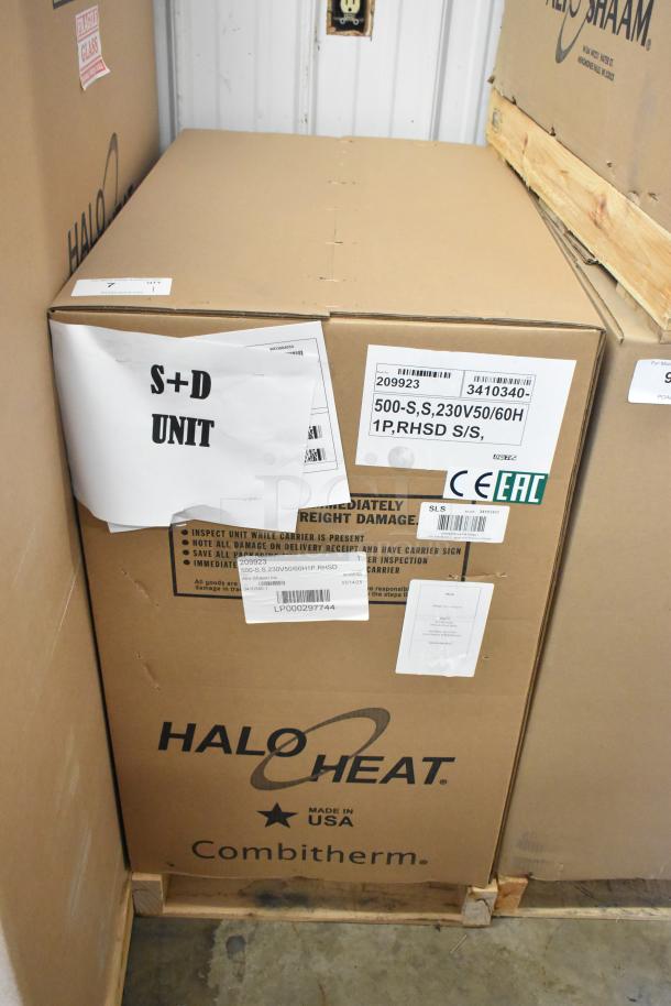 Brand new Alto Shaam 500-S stainless steel commercial holding cabinet in box. Holds 6 pans, 230V, 1 phase. Labels include model and voltage.