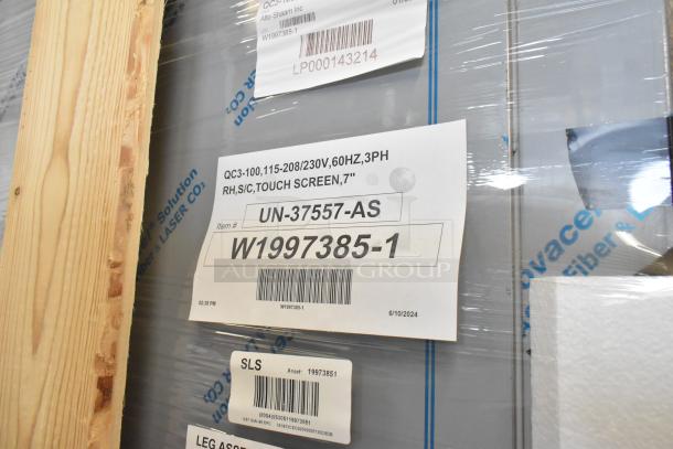 Brand new Alto Shaam QC3-100 stainless steel blast chiller in crate. Tags show model, voltage, and phase specifications.