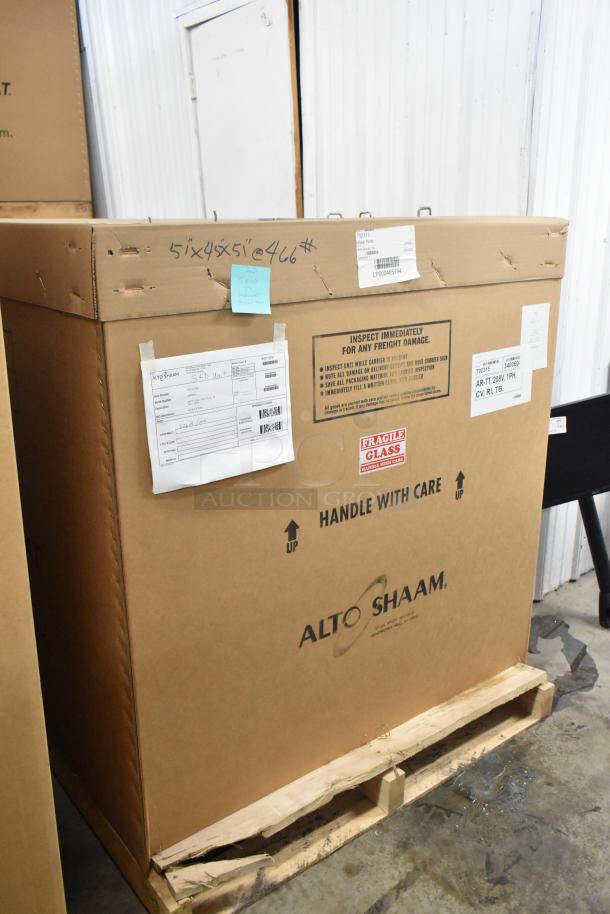 Brand new Alto Shaam AR-7T rotisserie oven in box, 208V, 1 phase, with shipping labels and "fragile" markings visible.