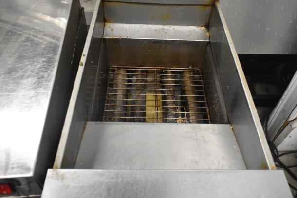 Pitco Frialator SG14 stainless steel propane deep fryer, 110,000 BTU, used condition, visible grates and interior.