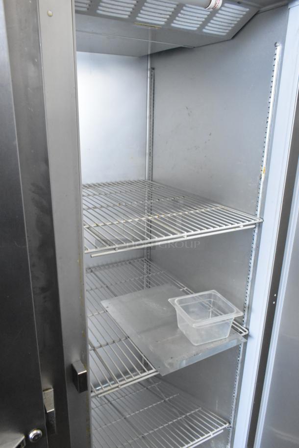 Beverage Air ER24-1AS stainless steel single door reach-in cooler with poly coated racks and commercial casters.