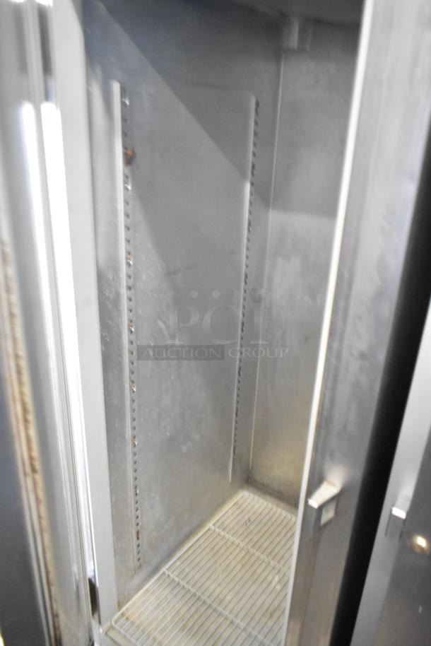 Continental DL1F-SA stainless steel reach-in freezer, single door, poly coated racks, 115V, 1 phase, commercial use.