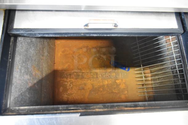 Continental CBC50 stainless steel bottle cooler, interior view showing rust and wire racks. Model CBC50, 115V, single phase.
