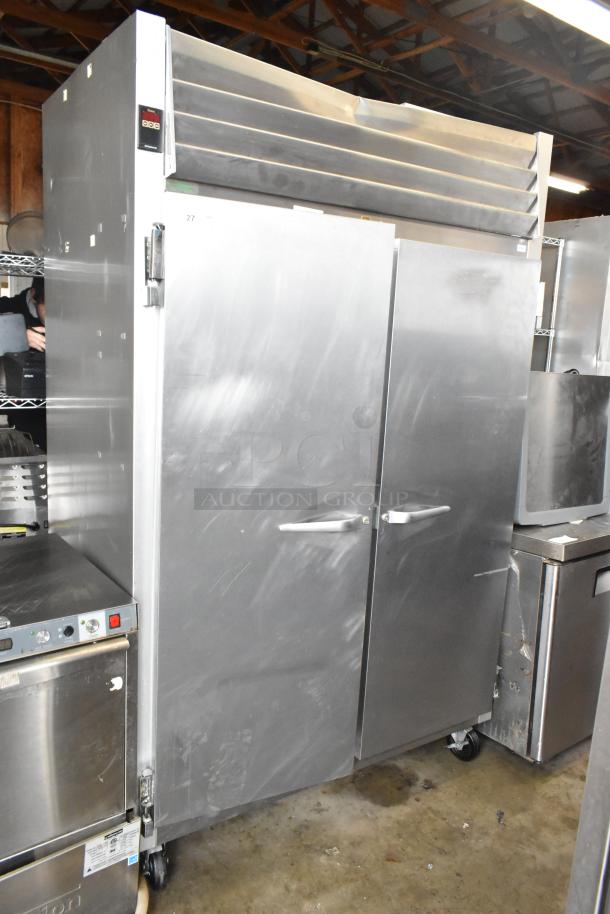 Traulsen G20010 stainless steel commercial 2-door reach-in cooler with poly-coated racks, on casters, 115V, 1 phase.