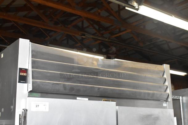 Traulsen G20010 stainless steel 2-door reach-in cooler with poly-coated racks, commercial casters, 115V, 1 phase.