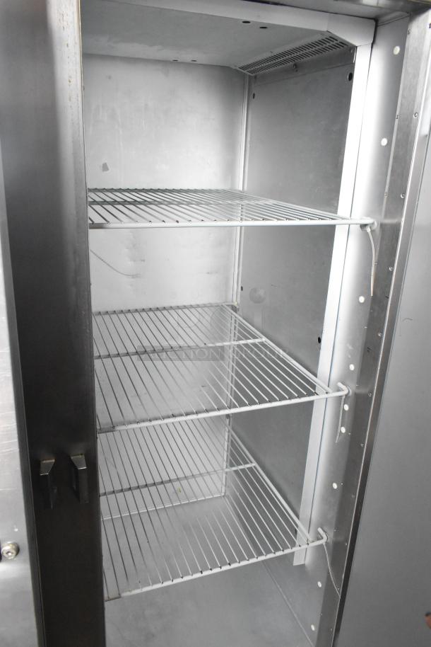 Traulsen G20010 stainless steel 2-door reach-in cooler with poly-coated racks, commercial casters, 115V, 1 phase.